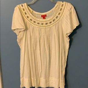 Beautiful off-white top with satin trim at neck